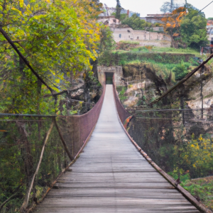 The Rupit Suspension Bridge offers an exhilarating experience as you cross it to reach the charming village of Rupit, with its cobblestone streets and rustic charm.